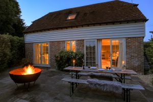 Image of the coach house terrace in twilight