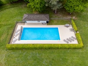 Image of the pool with the chairs laid out by the pool