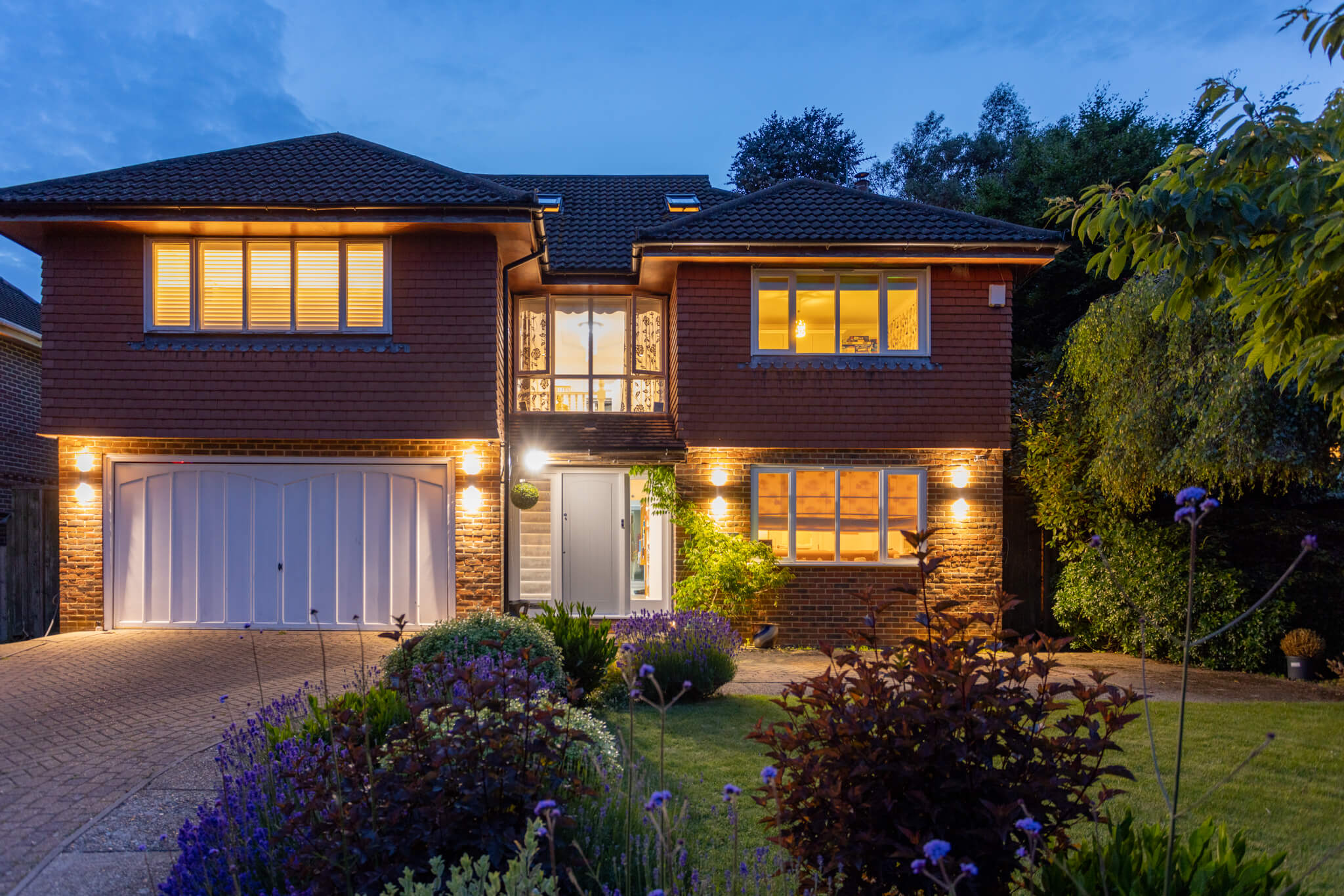 Twilight image of the front of the house